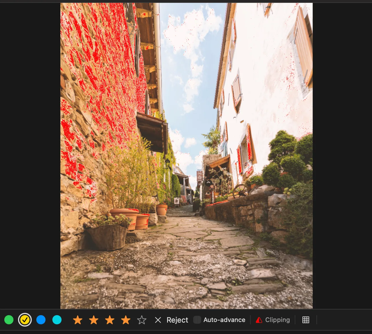 Clipping warning: the sunlit wall of the alley is painted red where the highlights are blown